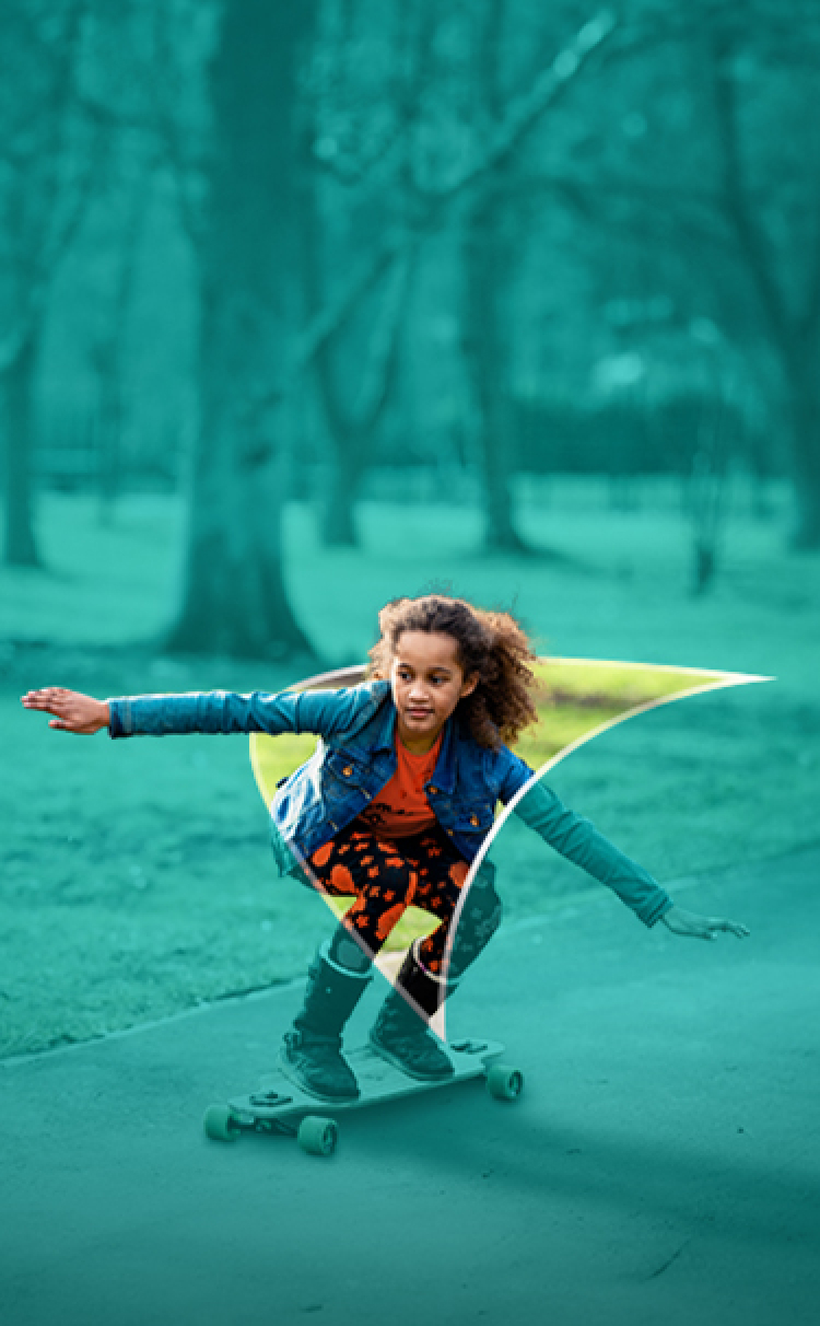 Picture of a young girl skateboarding. A liver shape appears behind her.