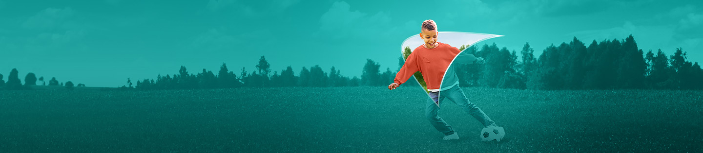 Picture of a young boy playing, kicking a soccer ball. A liver shape appears behind him.